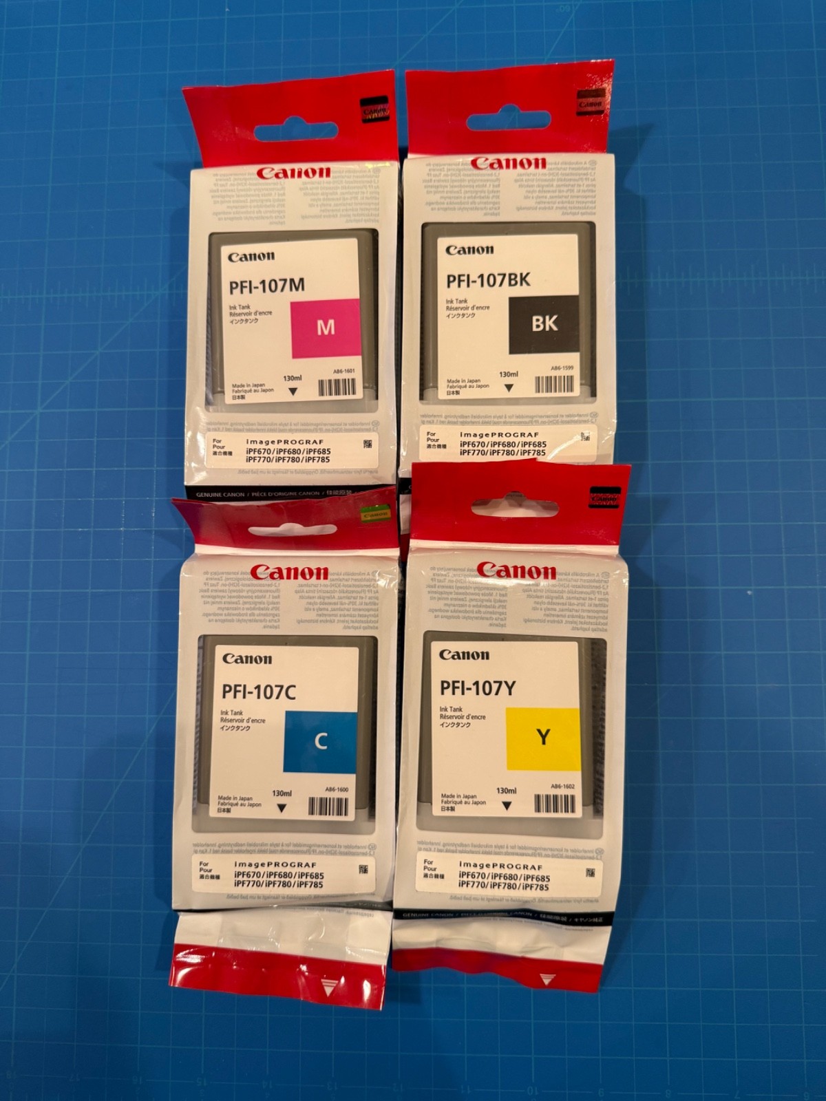 (Lot 4) Brand New Canon PFI-107. Black/Magenta/Cyan/Yellow Printer Cartridge