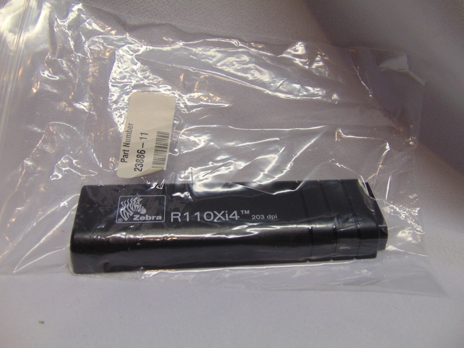 Zebra R110Xi4 203 dpi black plastic panel hardboard cover PN23886-11 new in box